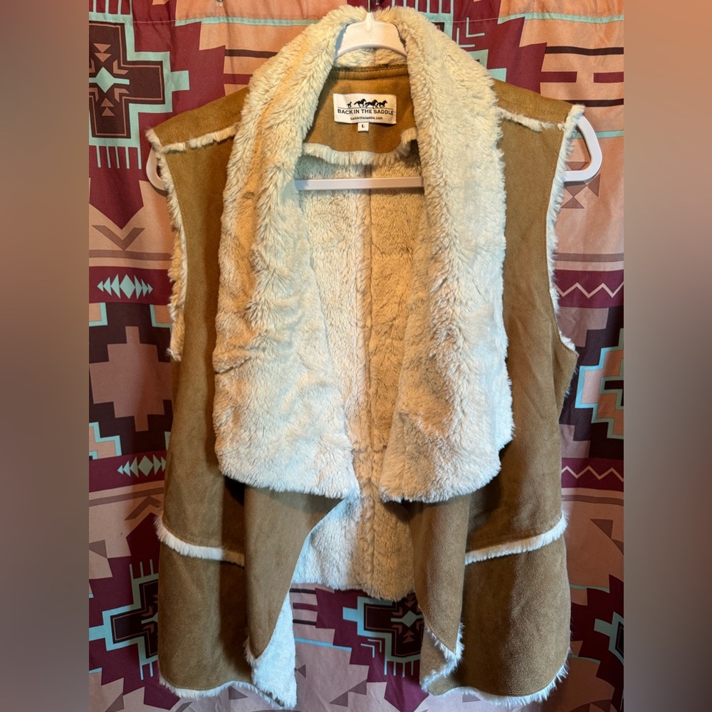 “Back In The Saddle” women’s large, suede, and tan colored vest. Cream faux fur.